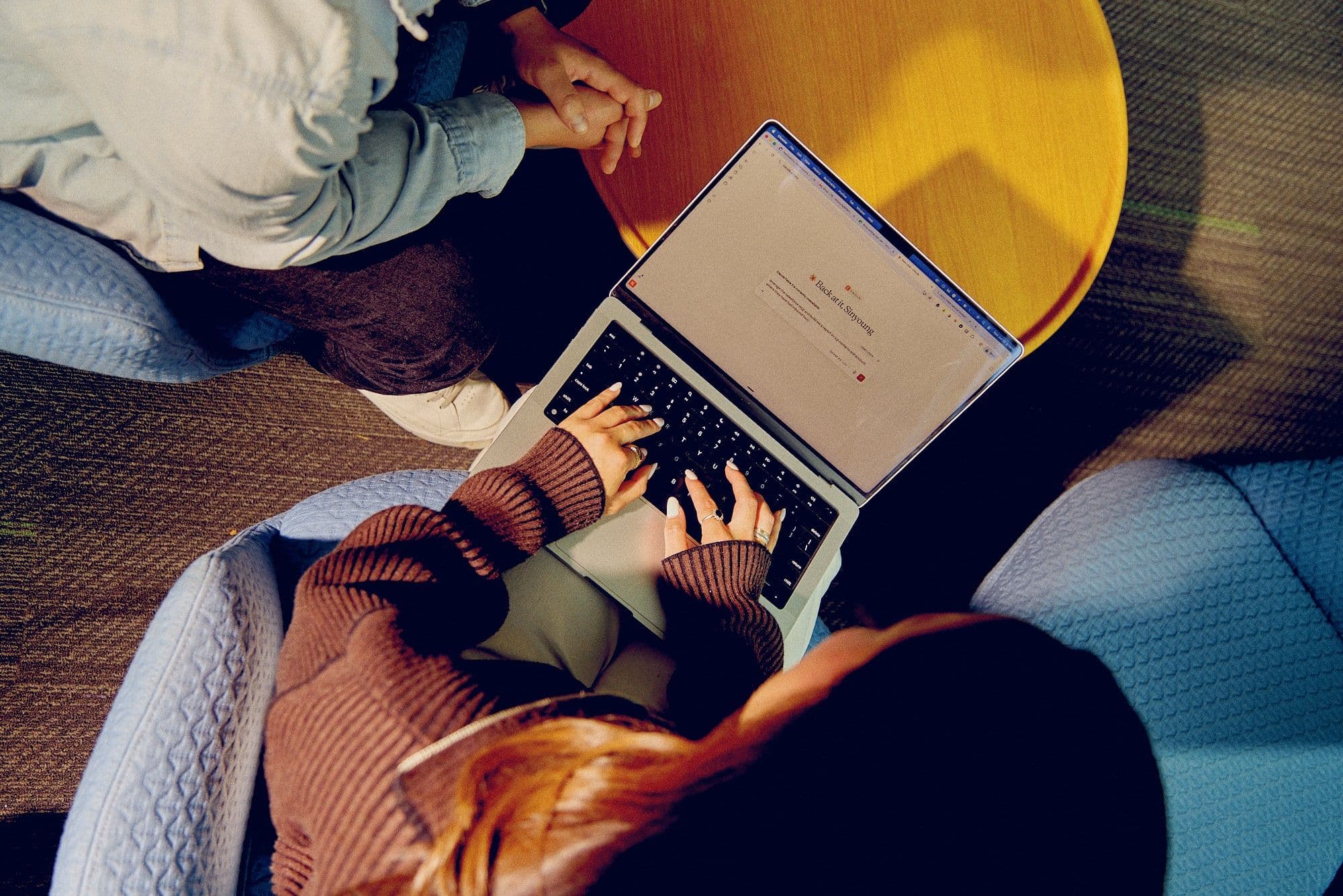 A Within team member working from a computer